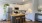 Spacious and well lit kitchen with wood flooring and stainless steel appliances